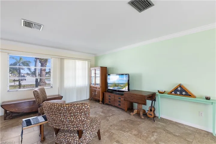 Living room featuring ornamental molding