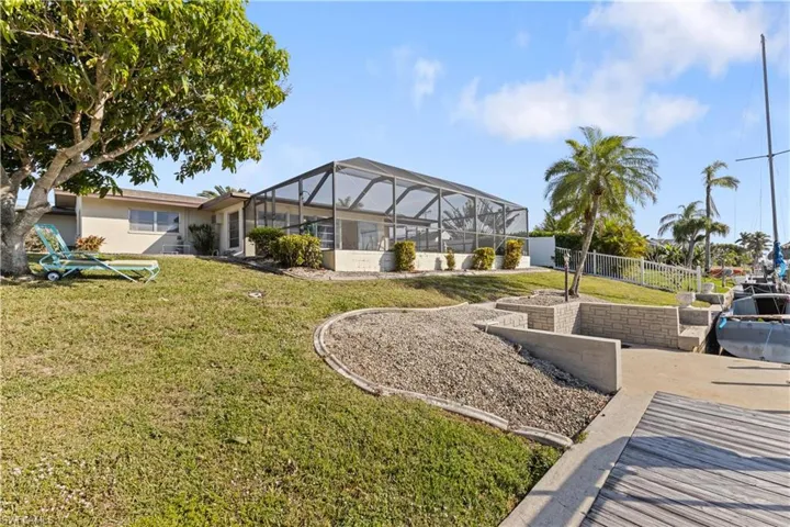 View of yard with a lanai