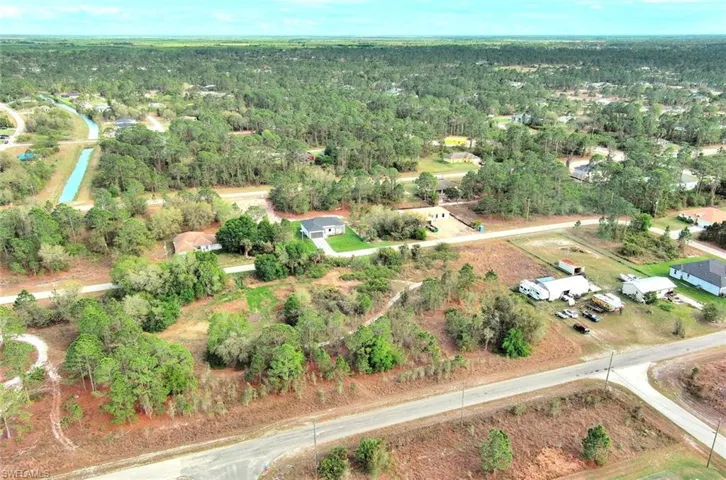Aerial overview of property's location featuring a forest