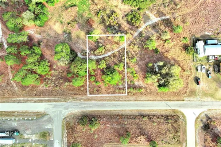 Aerial view of property's location featuring property parcel outlined