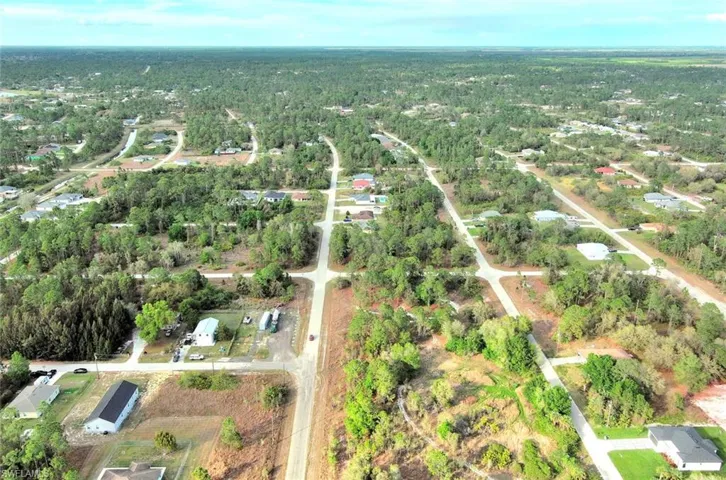 View of property location with nearby suburban area