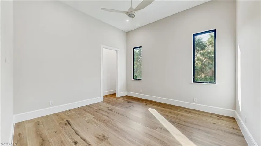 Empty room featuring light hardwood / wood-style floors and ceiling fan