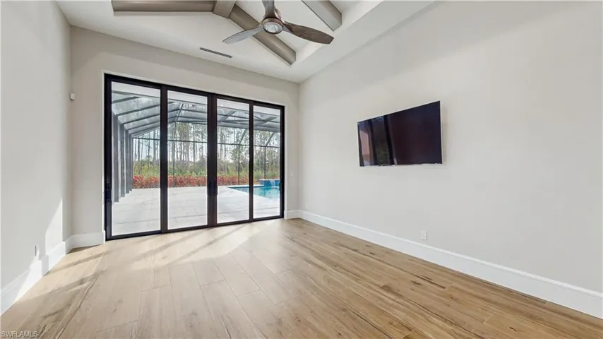 Empty room featuring ceiling fan and light hardwood / wood-style floors
