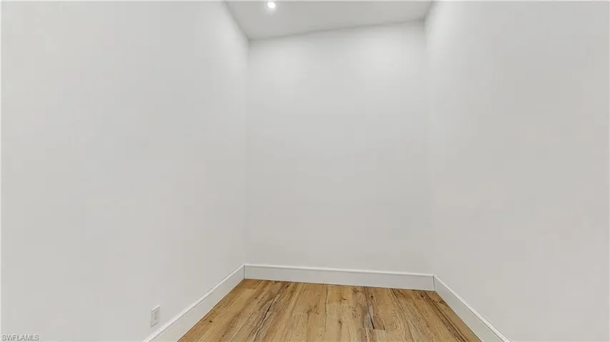 Unfurnished room featuring hardwood / wood-style floors