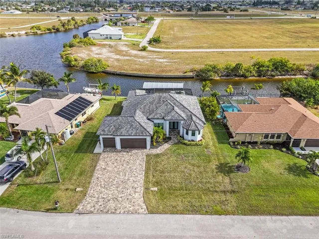 Aerial perspective of suburban area with a nearby body of water