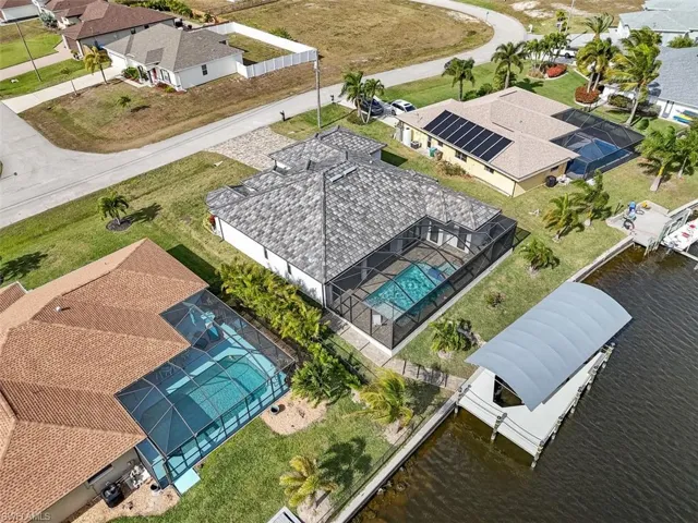 Aerial perspective of suburban area with a pool