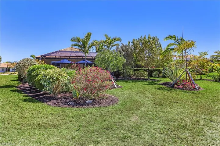 View of green lawn with a lanai