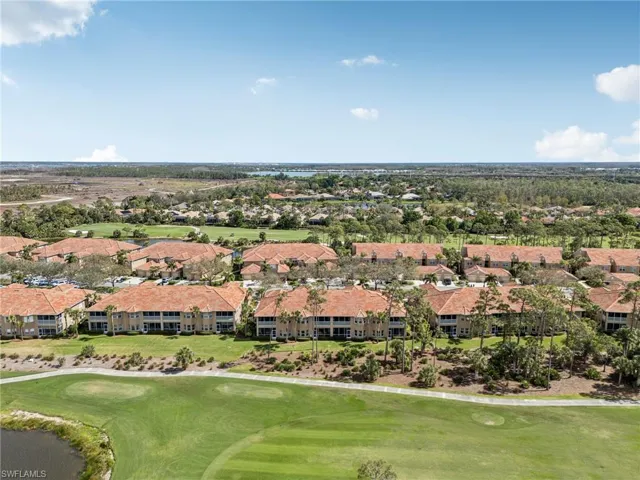 Birds eye view of property with view of golf course and a residential view