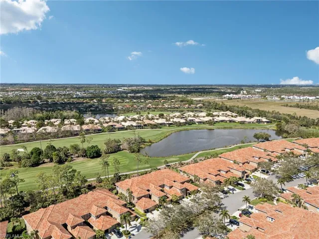 Drone / aerial view with a water view and a residential view