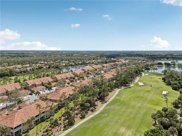 Drone / aerial view featuring a water view, a residential view, and golf course view