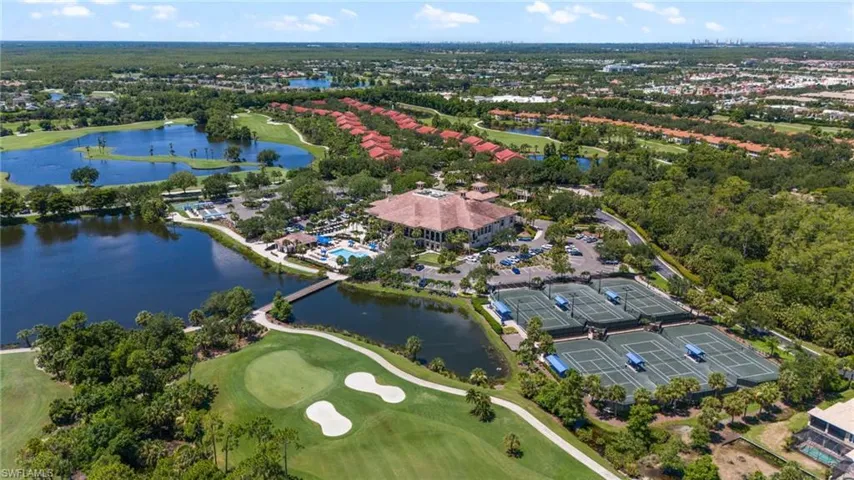 Aerial view with golf course view and a water view