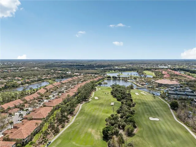 Aerial view featuring view of golf course and a water view