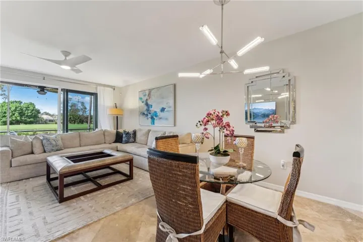 Dining room with ceiling fan and baseboards