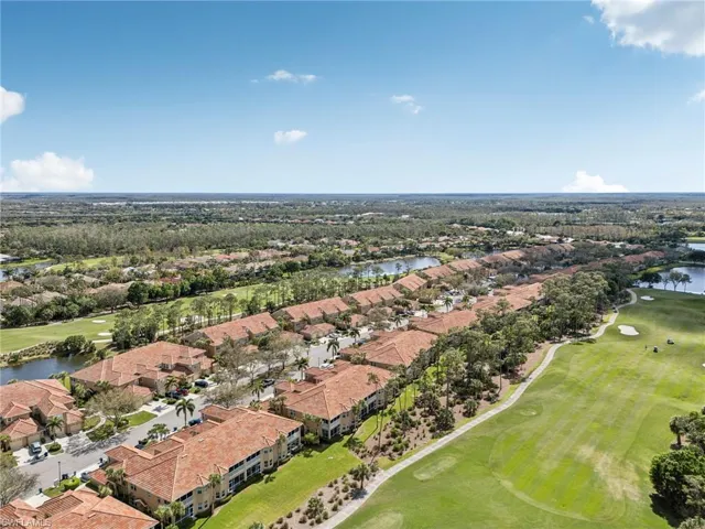 Birds eye view of property featuring a residential view, a water view, and golf course view