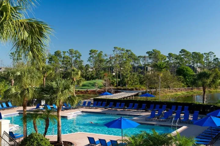 View of pool with a patio and a water view