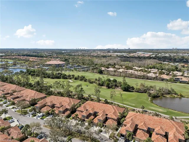 Aerial view featuring a residential view, a water view, and golf course view