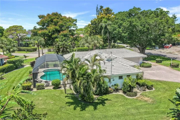 Large green spaces wrap around the entire property
