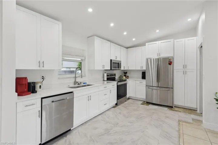 Kitchen with white cabinets