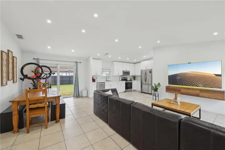 Open concept living room/dining/kitchen