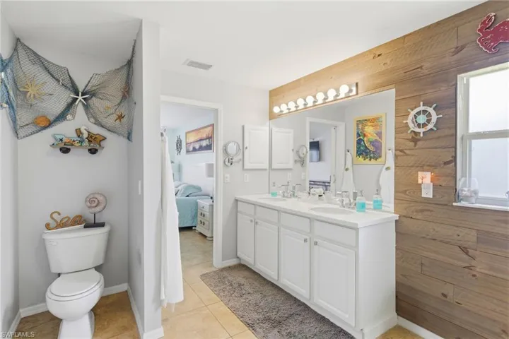 Start your day side by side—dual vanities make morning routines effortless, paired with a sleek, easy-access shower.