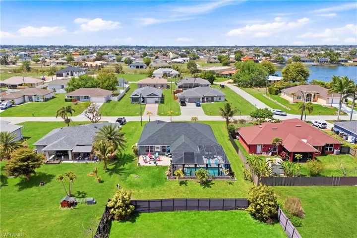 From above, the full beauty of this property comes into view, showcasing a thoughtfully designed layout and an outdoor space built for enjoyment.