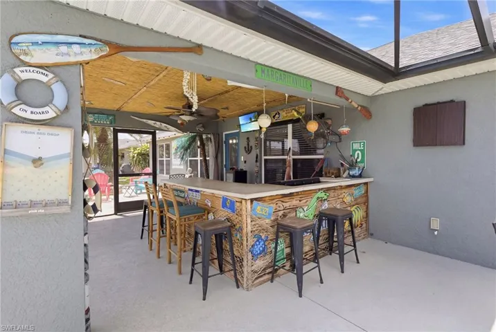 A fun and inviting outdoor space, complete with tiki bar for drinks, gatherings, and good times.