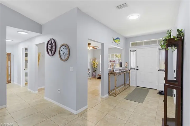 Spacious foyer with tile flooring, connecting seamlessly to the main living area.