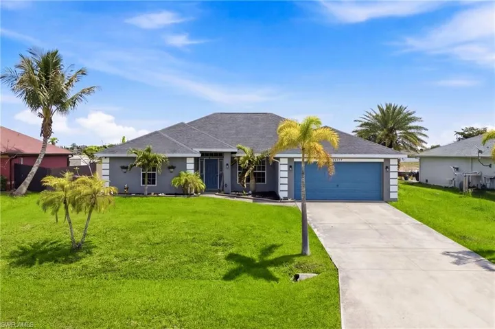 A stunning first impression—lush landscaping and inviting curb appeal welcome you home.