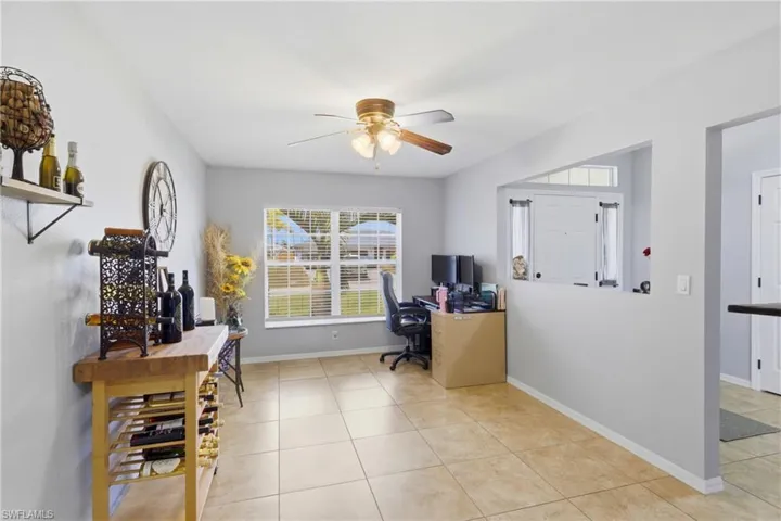 Flexible den space ideal for a home office, media room, or additional lounge area.