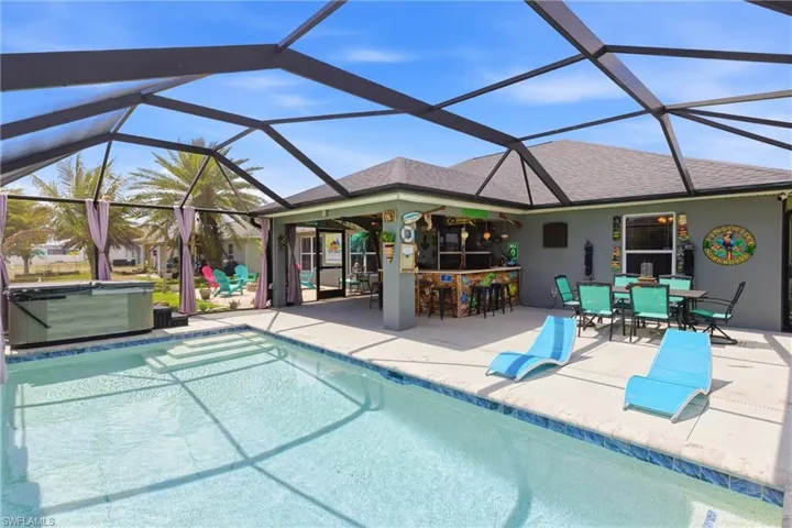 Resort-style outdoor living with a sparkling pool and relaxing hot tub.