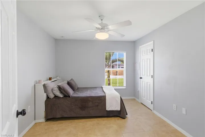 Guest bedroom with easy access to a shared Jack & Jill bathroom, perfect for family or visitors.