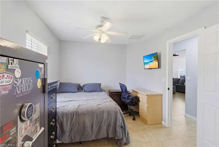 Comfortable guest bedroom offering direct access to a shared bathroom for convenience.