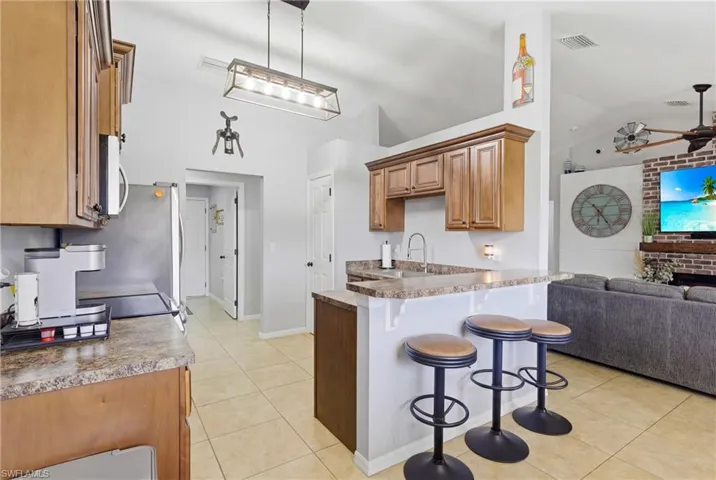 A welcoming kitchen with a breakfast bar that’s perfect for family gatherings, casual meals, or entertaining friends.