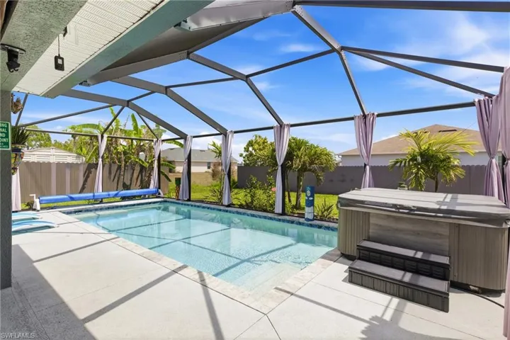 Your private backyard oasis—screened pool and spa ready for endless enjoyment.