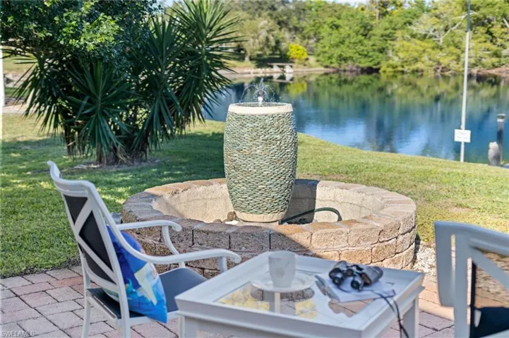 View of patio with a water view