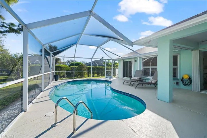 View of pool featuring a lanai and a patio area