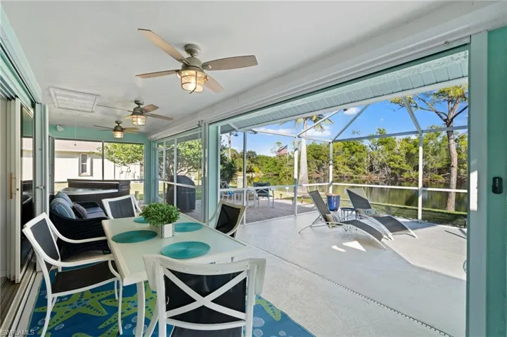 Sunroom / solarium featuring ceiling fan
