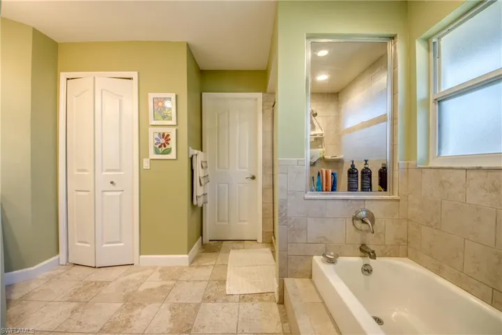 Bathroom featuring plus walk in shower