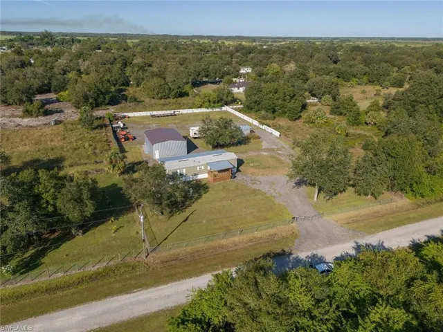 View from above of property with a forest