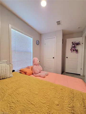 Bedroom with a closet and recessed lighting
