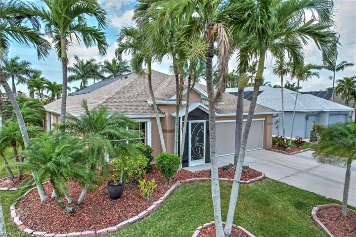 Ranch-style home featuring roof with shingles, stucco siding, concrete driveway, a garage, and a front lawn
