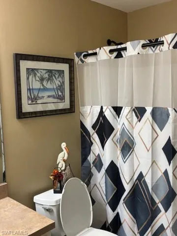Bathroom with vanity and a shower with curtain