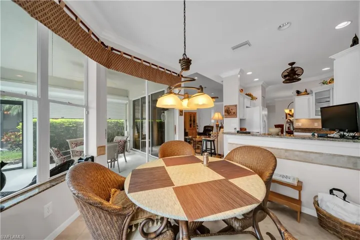 Dining room featuring crown molding and recessed lighting