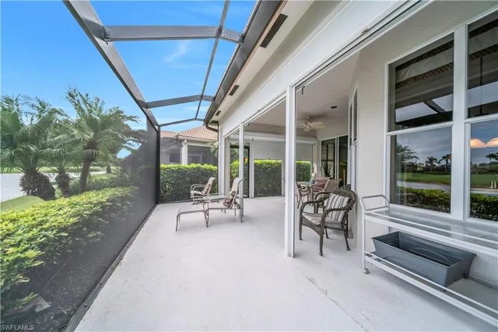 View of patio / terrace featuring a sunroom, a lanai, and ceiling fan