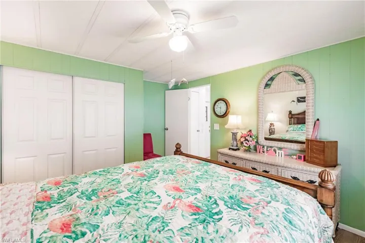 Bedroom featuring ceiling fan and a closet