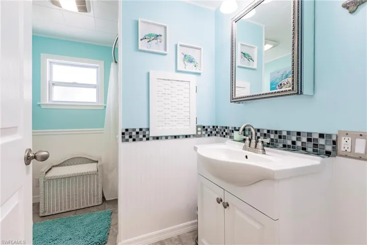 Bathroom featuring wainscoting and vanity