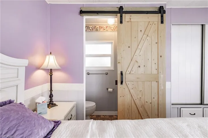 Bedroom featuring a barn door