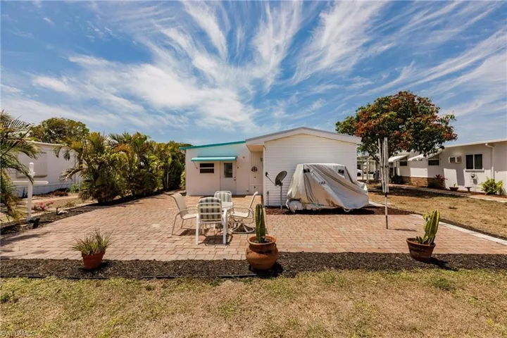 Back of property with a patio
