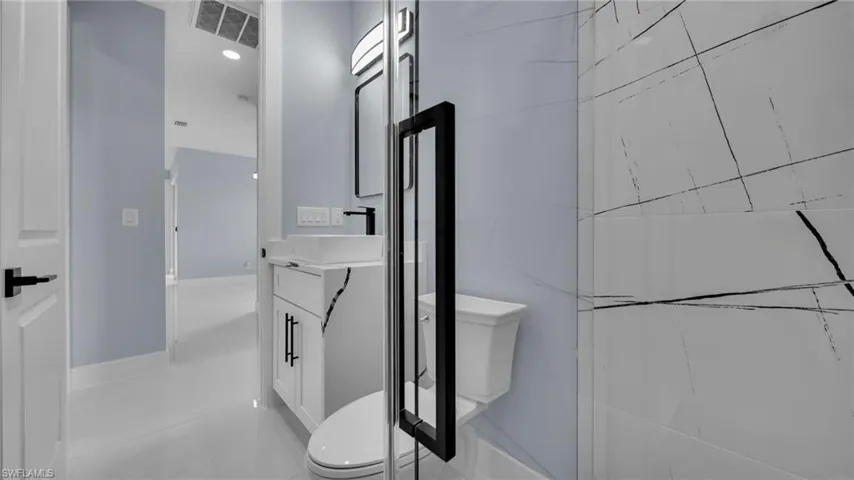 Bathroom with vanity and tile patterned flooring
