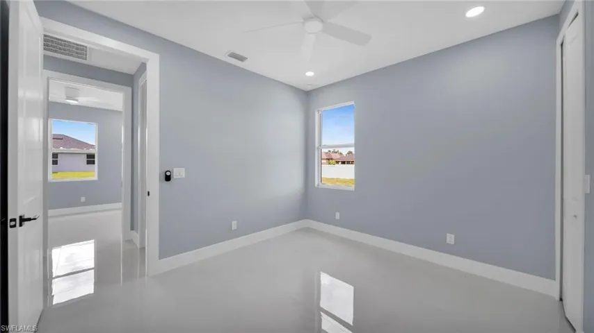 Unfurnished bedroom featuring ceiling fan and recessed lighting